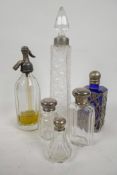 Three glass dressing table bottles with Hallmarked silver tops, together with three others with