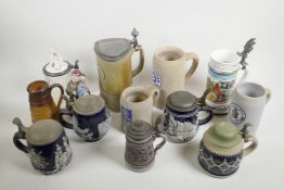 A collection of assorted German pottery beer steins, largest 9½" high
