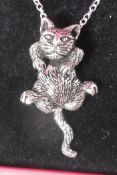 A silver articulated pendant in the form of a cat on a silver chain