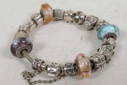 A Pandora silver charm bracelet, some set with crystal beads, gross 67g