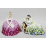 A Royal Doulton figurine, 'Solitude' HN2810, together with another Royal Doulton figurine 'Victoria'