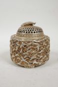 A Chinese white metal cylinder censer and cover, the side decorated with many storks in flight and