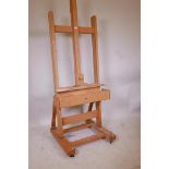 A Mabef artist's studio easel on castors, lacks winder, 90" high