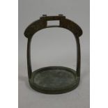 A Chinese bronze stirrup engraved with bats, 6" long