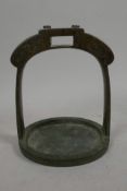 A Chinese bronze stirrup engraved with bats, 6" long