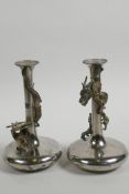 A pair of Oriental metal specimen vases with applied decoration of entwined dragons, 6" high