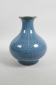 A Chinese blue glazed porcelain vase with a flared gilt rim and underglaze floral decoration, seal