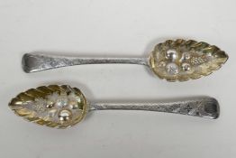 A matching pair of Georgian sterling silver berry spoons, hallmarked Edward Lees of London, 1808,