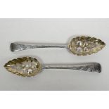 A matching pair of Georgian sterling silver berry spoons, hallmarked Edward Lees of London, 1808,