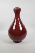 A Chinese flambe glazed garlic head shaped vase, 13½" high