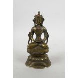 A Chinese gilt bronze of Buddha seated on a lotus throne with inset semi-precious stones, 6