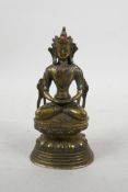 A Chinese gilt bronze of Buddha seated on a lotus throne with inset semi-precious stones, 6