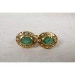 A pair of oval yellow 14ct gold emerald and diamond earrings