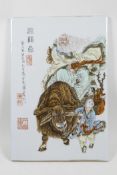 A Chinese polychrome porcelain panel decorated with a sage riding a buffalo being led by a child,