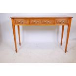 A Bevan Funnell yew wood Regency style serving table with two drawers raised on tapering supports