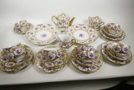 A late C18th/early C19th Japanese Nippon era porcelain part tea service painted with roses in gilded