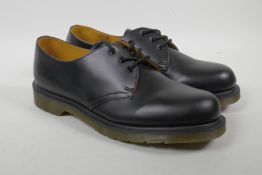 A pair of Dr Martens with an air cushion sole, embossed Royal Mail stamp to heel, size 10