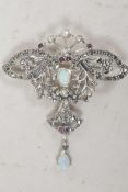 A silver and marcasite butterfly shaped pendant brooch set with opalite and rubies