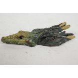 A cold painted bronze money clip in the form of an alligator, 5½" long
