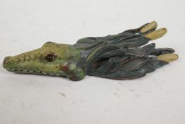 A cold painted bronze money clip in the form of an alligator, 5½" long