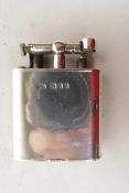 A Dunhill solid silver lighter with English hallmarks