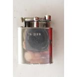 A Dunhill solid silver lighter with English hallmarks