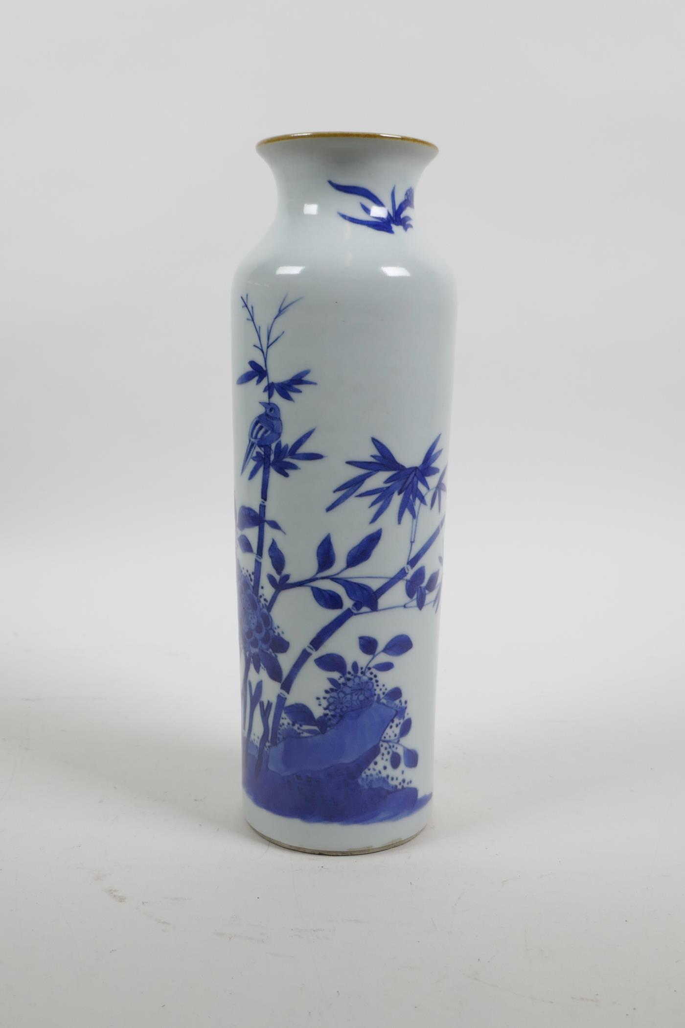 A Chinese blue and white porcelain cylinder vase decorated with birds and butterflies amongst bamboo - Image 4 of 5