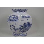A Chinese blue and white double gourd vase decorated with a variation on the Willow Pattern, marks