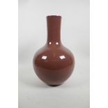 A Chinese red glazed crackleware bottle vase, seal mark to base, 12" high