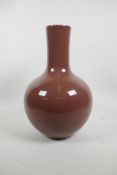 A Chinese red glazed crackleware bottle vase, seal mark to base, 12" high