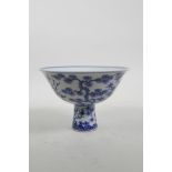 A Chinese Ming style blue and white porcelain stem cup decorated with native flora, 6 character mark