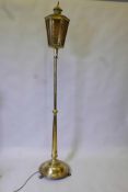 A brass standard lamp with lantern shade, early C20th, 74" high