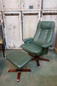 A revolving and reclining leatherette chair and matching footstool