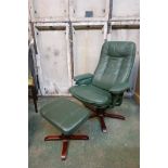 A revolving and reclining leatherette chair and matching footstool