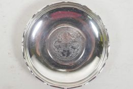 A Hong Kong sterling silver pin tray set with a one dollar coin, 3½" diameter, gross 63 grams