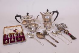A silver plated tea set, grapefruit spoons, serving spoons etc