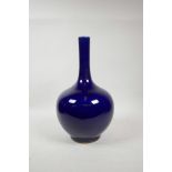 A Chinese powder blue glazed porcelain bottle vase with a slender neck, 14½" high