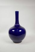 A Chinese powder blue glazed porcelain bottle vase with a slender neck, 14½" high