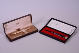 A Cross 14kt rolled gold fountain pen with 14kt gold medium nib, in its original case, along with