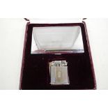 An Abdulla two piece cigarette lighter and case in presentation box