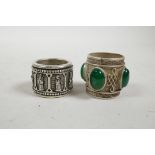 A Chinese white metal archer's thumb ring set with jade style stones, and another, 1"