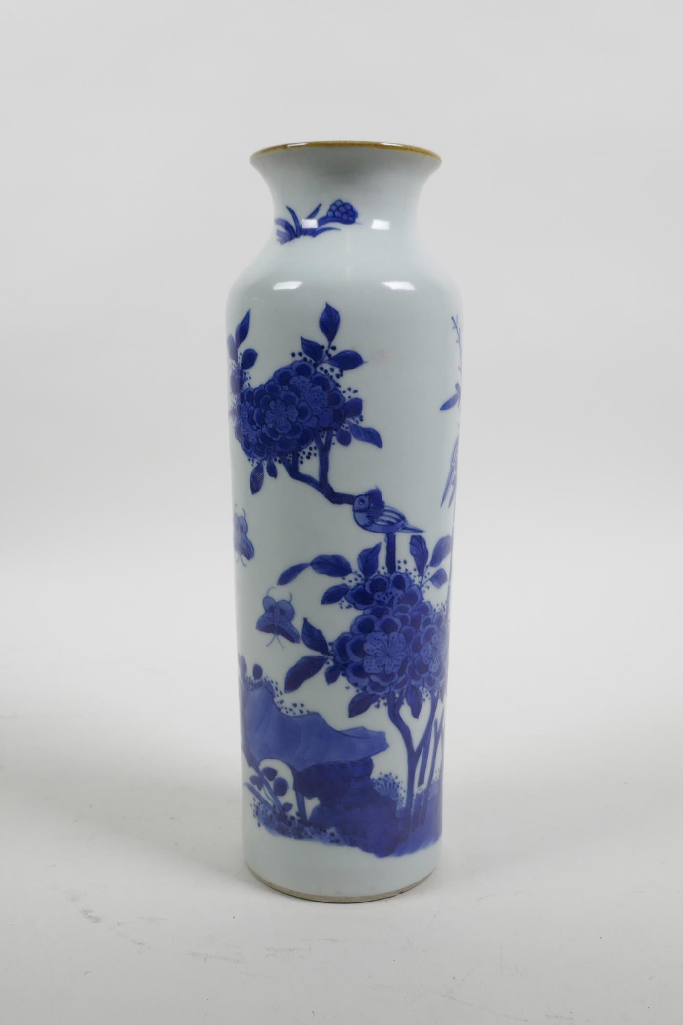 A Chinese blue and white porcelain cylinder vase decorated with birds and butterflies amongst bamboo - Image 2 of 5