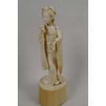 A 1920s Japanese carved ivory figure of a geisha with a fan, 6¼" high