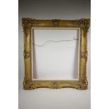 A good carved picture frame, with pierced scroll decoration, C20th, rebate 23½" x 21½"