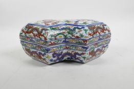 A Chinese wucai porcelain box and cover decorated with dragons and the flaming pearl, 6 character