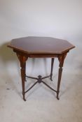 A Victorian plum pudding mahogany octagonal centre table with crossbanded inlay to the top, on
