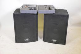 A pair of Peavey PA amps, and a JTS MH850 wireless microphone, boxed