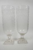 A pair of tall cut glass hurricane lamp vases on square pedestal base, 13½" high