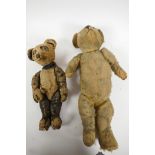 An early C20th toy panda with hump back and glass eyes, 12" long, together with an early plush teddy