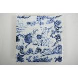 A Chinese blue and white pottery tile decorated with two sages and a buffalo in a landscape, 8" x 8"